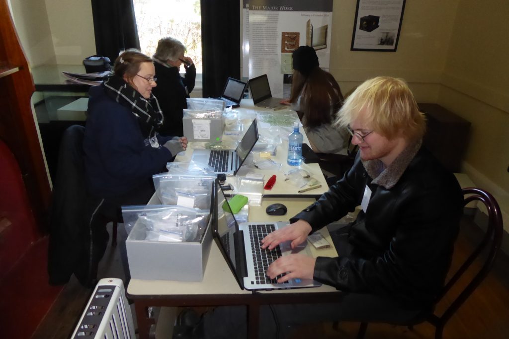 photograph of UNE students assisting with the collections project